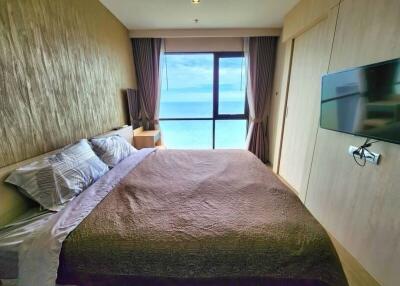 Cozy bedroom with ocean view and modern amenities