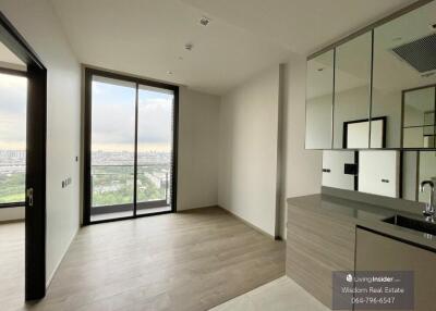 Modern kitchen with city view in a high-rise apartment