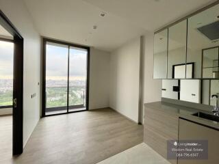 Modern kitchen with city view in a high-rise apartment