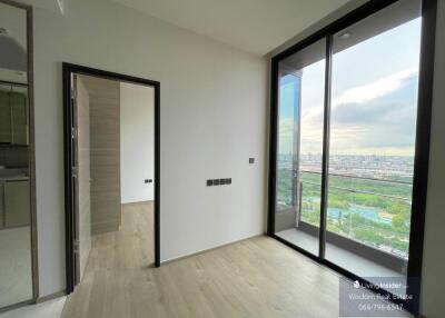 Modern bedroom with large windows and scenic city view