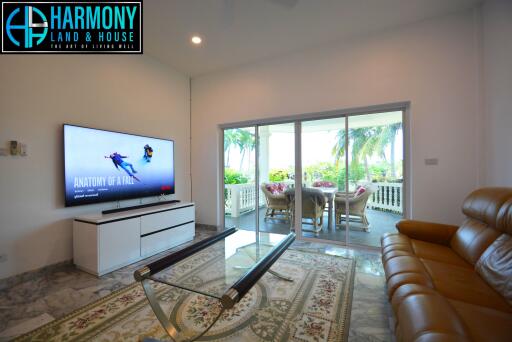 Spacious living room with modern amenities and ocean view