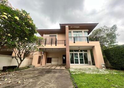 Modern two-story house with spacious driveway and lawn