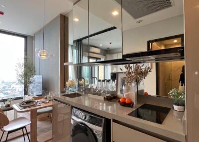 Modern kitchen with integrated appliances and city view