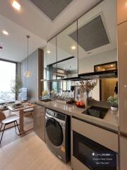 Modern kitchen with integrated appliances and city view