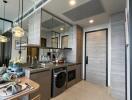 Modern kitchen with integrated dining space and stylish lighting