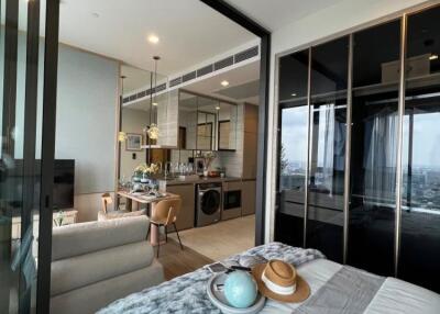Modern bedroom with open layout and view of kitchen