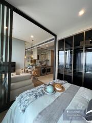 Modern bedroom with open layout and view of kitchen