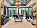 Spacious and elegant living room with large windows and luxurious decor