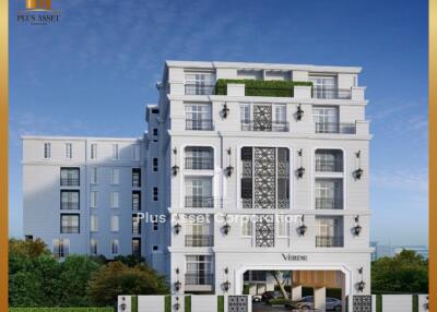 Modern residential building exterior with balconies and green rooftop