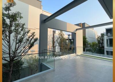 Spacious modern balcony with a view of the surrounding buildings and nature