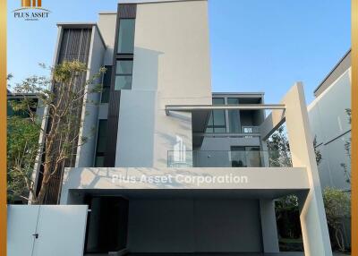 Modern two-story residential home with clean architectural lines and large windows