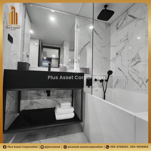 Modern monochrome bathroom with marble tiles