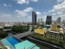 Aerial view of urban skyline with apartment buildings and a swimming pool