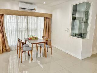 Bright and spacious dining area with modern furniture and natural light