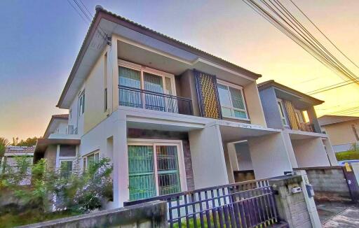 Modern two-story house at sunset