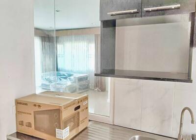 Modern kitchen with stainless steel sink and minimalist cabinets