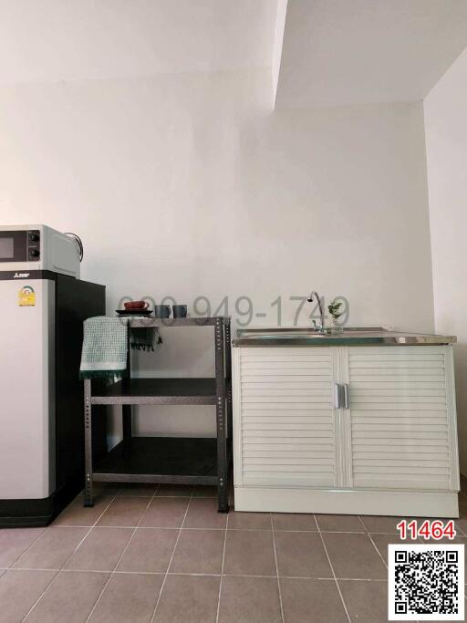 Compact kitchen area with modern appliances