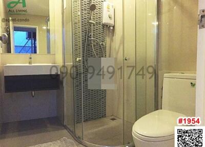Modern bathroom with shower, sink and toilet