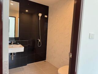 Modern bathroom with walk-in shower and sleek design