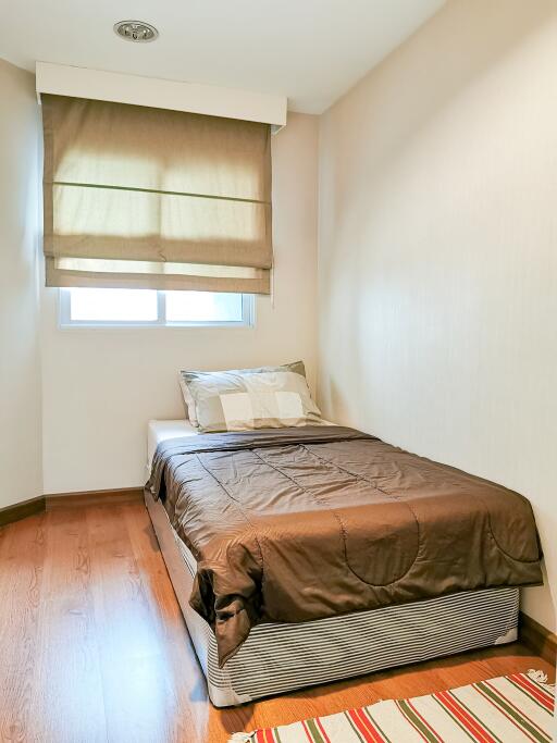 Cozy bedroom with natural light and modern decor