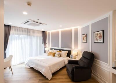 Elegant and well-lit bedroom with contemporary design