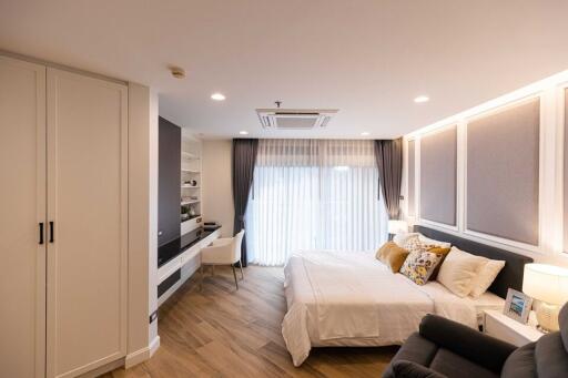 Modern bedroom with integrated workspace