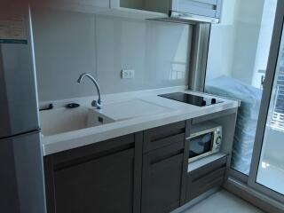 Modern kitchen with sleek cabinetry and integrated appliances