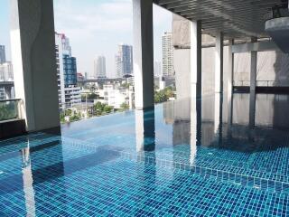 Luxurious rooftop swimming pool with city skyline view