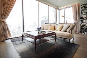 Elegant living room with large windows and city view