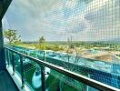 Spacious balcony with safety net overlooking scenic landscape