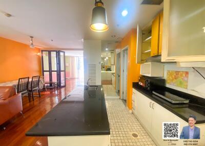 Spacious kitchen with modern amenities and adjoined dining area