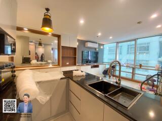 Modern kitchen with island and large windows