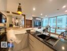 Modern kitchen with island and large windows