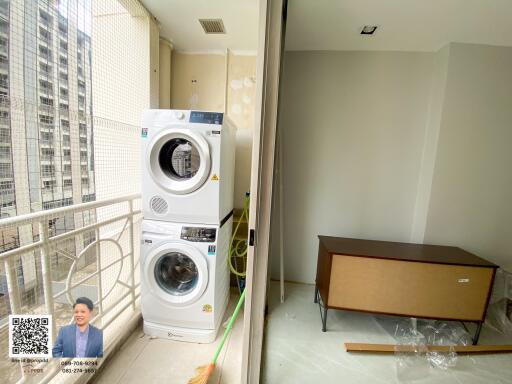 Balcony with laundry machines and furniture