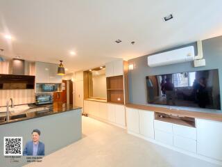 Modern open-plan kitchen and living area with contemporary design