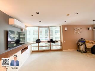 Spacious living room with large windows