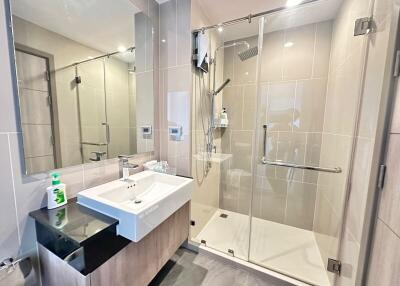 Modern bathroom with walk-in shower and sleek fixtures