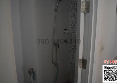 Modern bathroom with shower facility and mosaic tiles