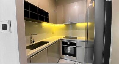 Modern kitchen with integrated appliances and LED lighting