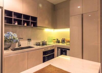 Modern kitchen with integrated appliances and ample cabinetry