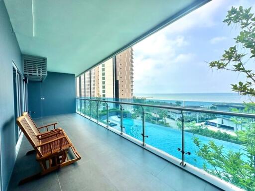 Spacious balcony with ocean view and pool view