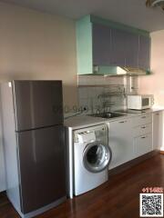 Modern kitchen with stainless steel appliances and white cabinets