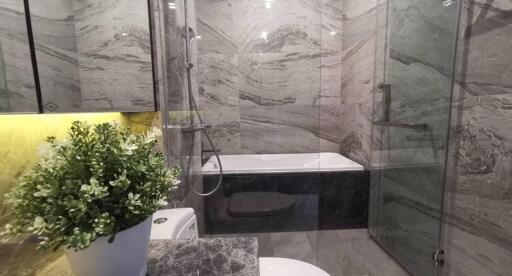 Modern bathroom with marble walls and elegant fixtures