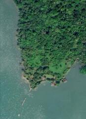 Aerial view of a lush green peninsula surrounded by water