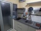 Compact modern kitchen with fitted appliances