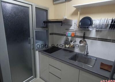 Compact modern kitchen with fitted appliances