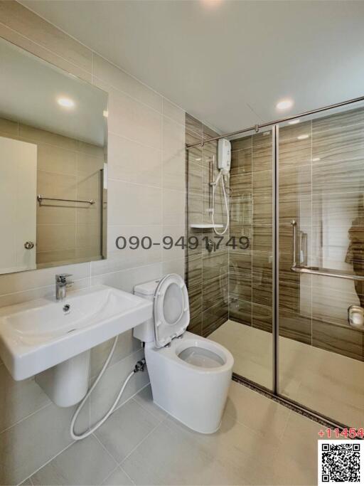 Modern Bathroom with Glass Shower Enclosure and White Fixtures