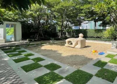 Spacious garden area with playful design and greenery