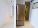 Refrigerator in hallway of modern apartment