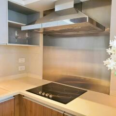 Modern kitchen with sleek appliances and wooden cabinetry